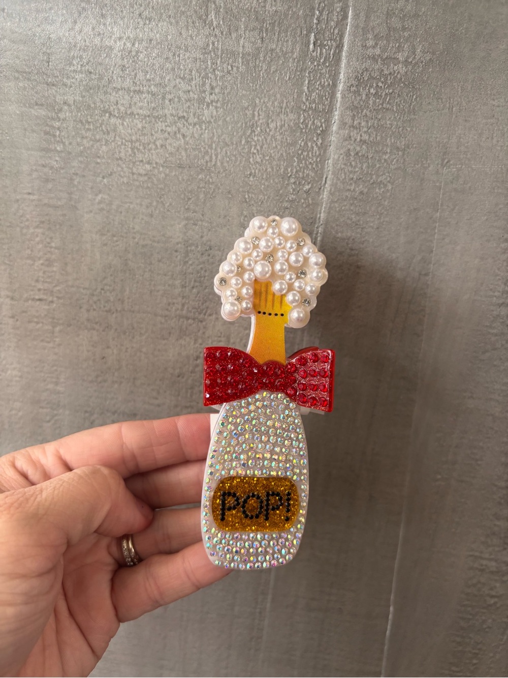 Rhinestone Champagne Bottle Pin with Pearl Top and Red Bow